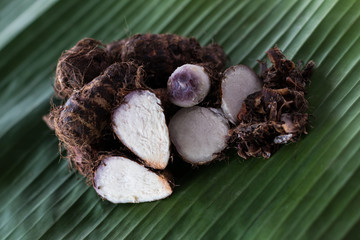 Boiled taro, banana leaves.