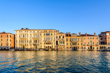 Typical venetian buildings from the waterside of Grand Canal int the golden hour, Venice (Venezia), Italy, Europe
