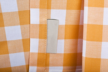 Yellow plaid fabric tablecloth closeup
