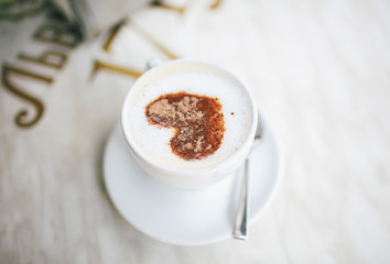 Lovely heart made from cacao on the cappuccino