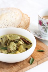 Mutton stew served with Appam - Traditional Kerala Breakfast, selective focus