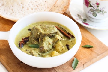 Mutton stew served with Appam - Traditional Kerala Breakfast, selective focus