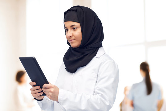 Muslim Female Doctor In Hijab With Tablet Pc