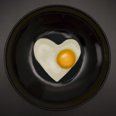 Breakfast on Valentine's Day-fried egg in the shape of a heart