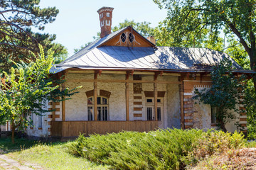 Taul Park, old ruined entrance main red building, north of Moldova