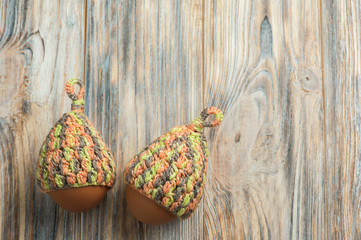 Easter eggs in knitted hats