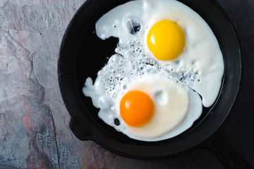 Scrambled eggs  on the dark stone background top view