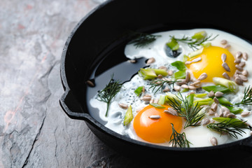 Scrambled eggs  on the dark stone background horizontal