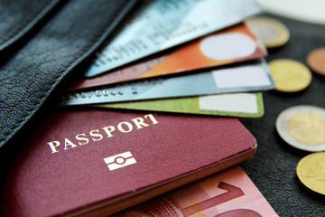 credit cards, passport, money, peeking out from the bag, closeup