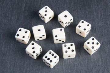 white dice on dark background	