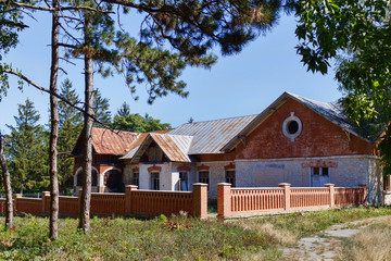 Taul Park, old ruined red village houses with fences, north of Moldova