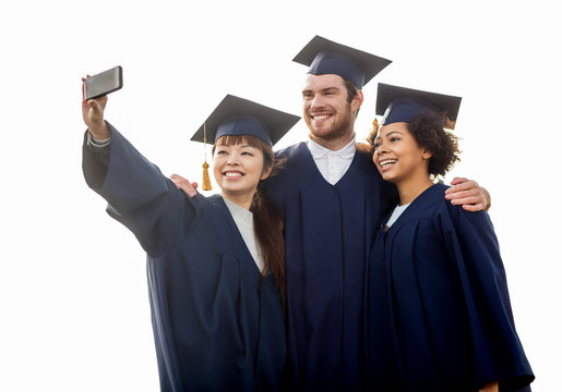 students or bachelors taking selfie by smartphone
