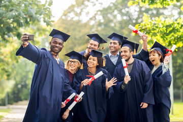 students or bachelors taking selfie by smartphone
