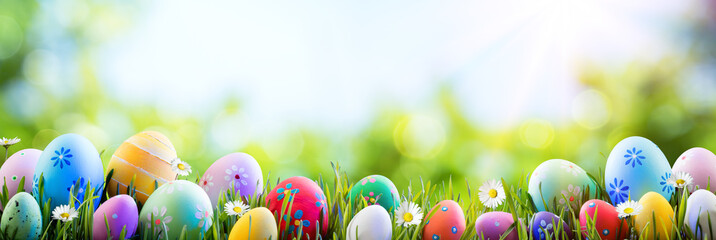 Naklejka premium Easter - Colorful Decorated Eggs On Field 