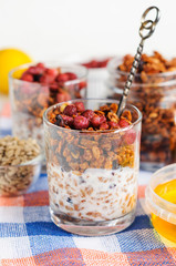 Granola with berries and yogurt in glasses