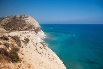 Fototapeta na wymiar High rocky road above the blue sea of Cyprus