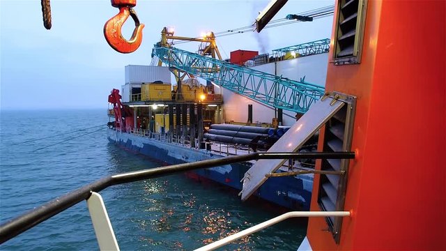 View of pipelayaer with crane from iced deck