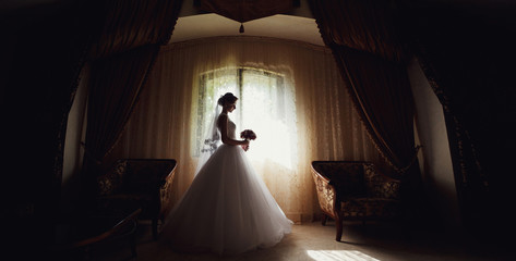 Bride in the gorgeous room in the wedding day