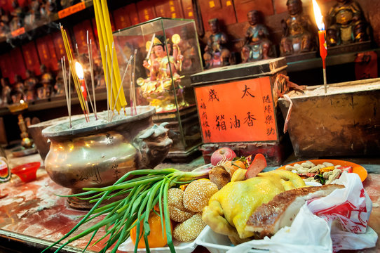 Food offerings left on the altar at Tin Hau Temple, Yau Ma Tei, Hong Kong.