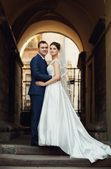 Fototapeta premium young happy couple posing for a photographer in the street