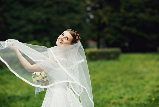 gorgeous bride spends her  free time in the park