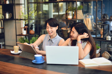 Asian woman working in coffee shop