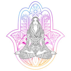 Woman sitting in lotus position on color hamsa hand background.