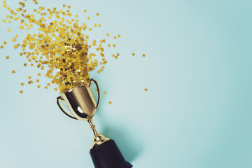 gold winner cup on blue background