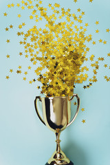 gold winner cup on blue  background