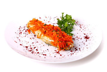 Fried fish covered with carrot