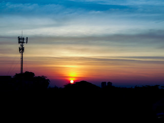 Twilight time of bangkok cityscape with radio pole silhouette