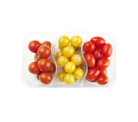 Three types of cherry tomatoes in the package isolated on white