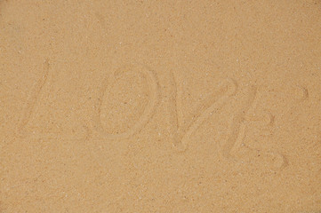 Love message written in sand, Word love on sand