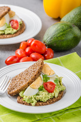 Fototapeta na wymiar Healthy bread with avocado spread