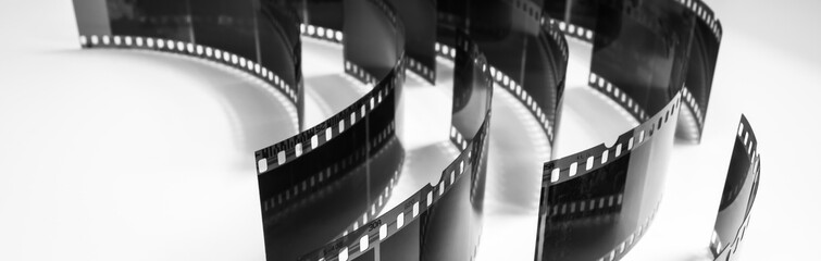 black and white photo of old negatives on a white background