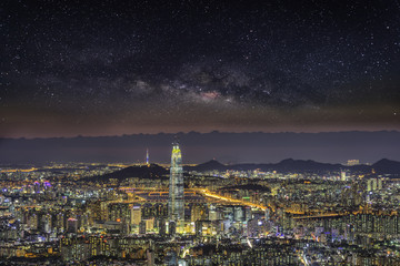 Fototapeta na wymiar Skyline, Seoul capital in misty night and galaxy.
