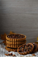 Autumn delicious cakes with nuts on plate.