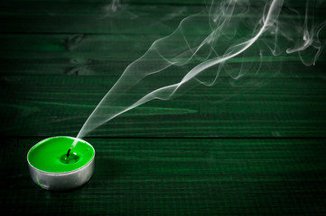 Extinguished candle with smoke. Metaphor of the death.