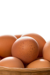 Close Up of Brown Chicken Eggs in Basket Copy Space