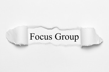 Fototapeta premium Focus Group on white torn paper