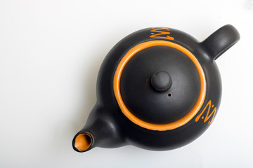 Black teapot isolated on white