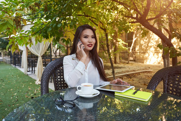 Skilled female entrepreneur dressed in office wear having conversation with administrative manager...