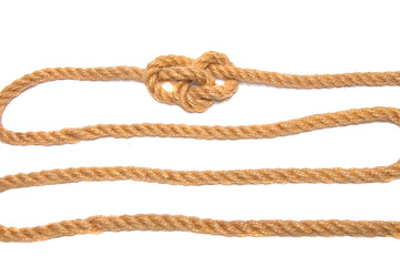 hemp rope with a knot. isolated on white.