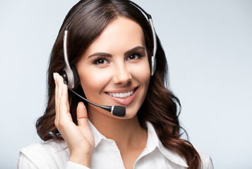 Portrait of happy smiling customer support female phone operator