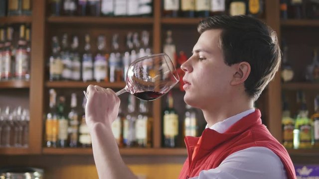 Sommelier tating the wine