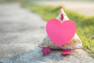 Fototapeta premium chicken cloth puppet with heart card