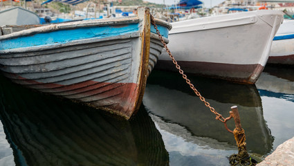 Fototapeta na wymiar old wooden fishing boats at the pier