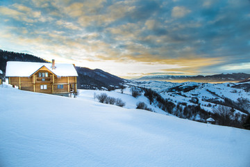 Wooden Home in the mountains. Winter Carpathian mountains