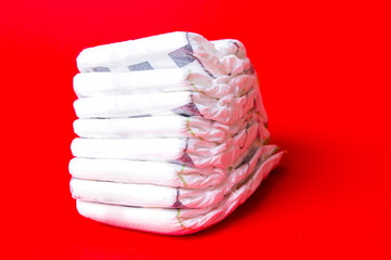 diapers stappled on red background