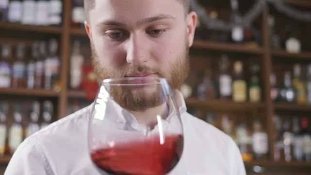 Sommelier tating the wine, slow motion